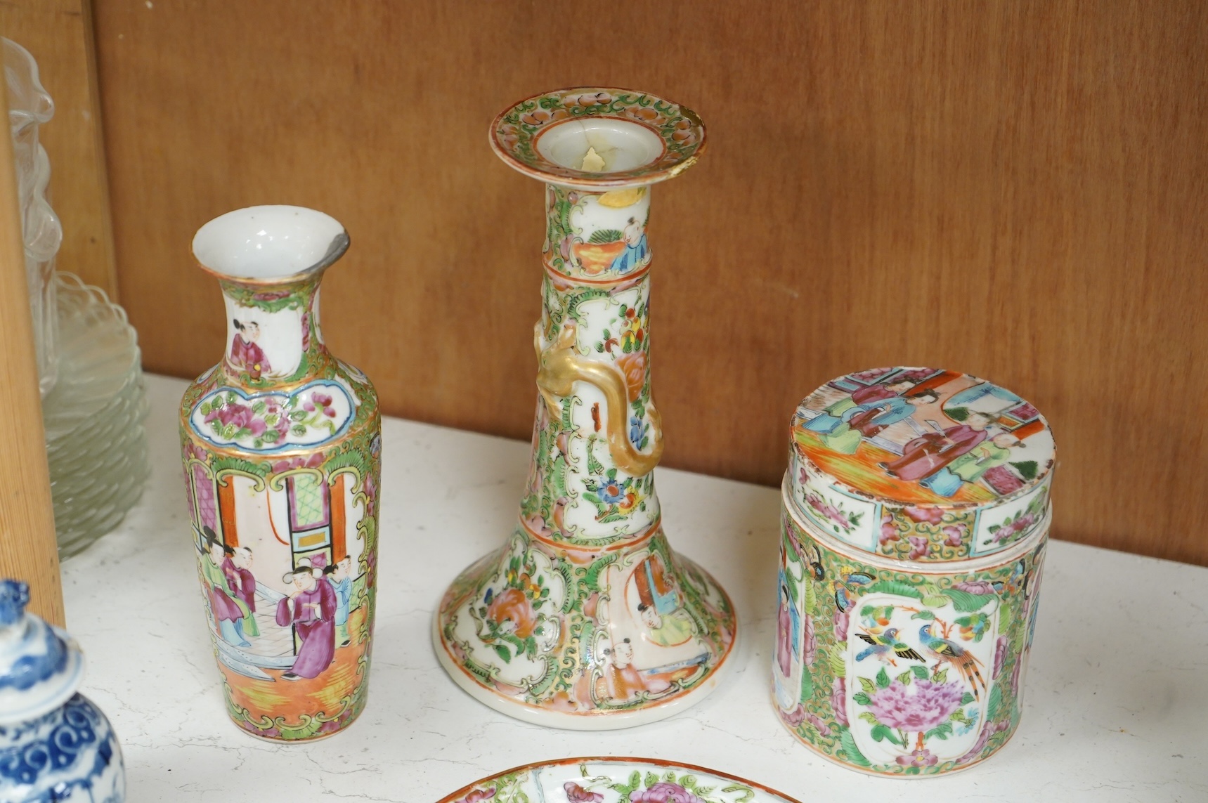 A collection of 19th century Chinese porcelain to include a pair of famille rose candlesticks, dish and a pair of blue and white baluster vases and covers